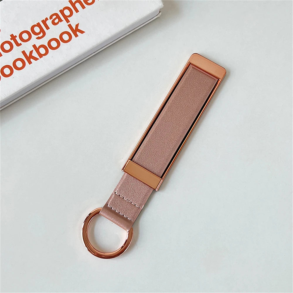 🎀 Soporte metálico para teléfono – Banda de dedo adhesiva y telescópica para sujetar o colgar