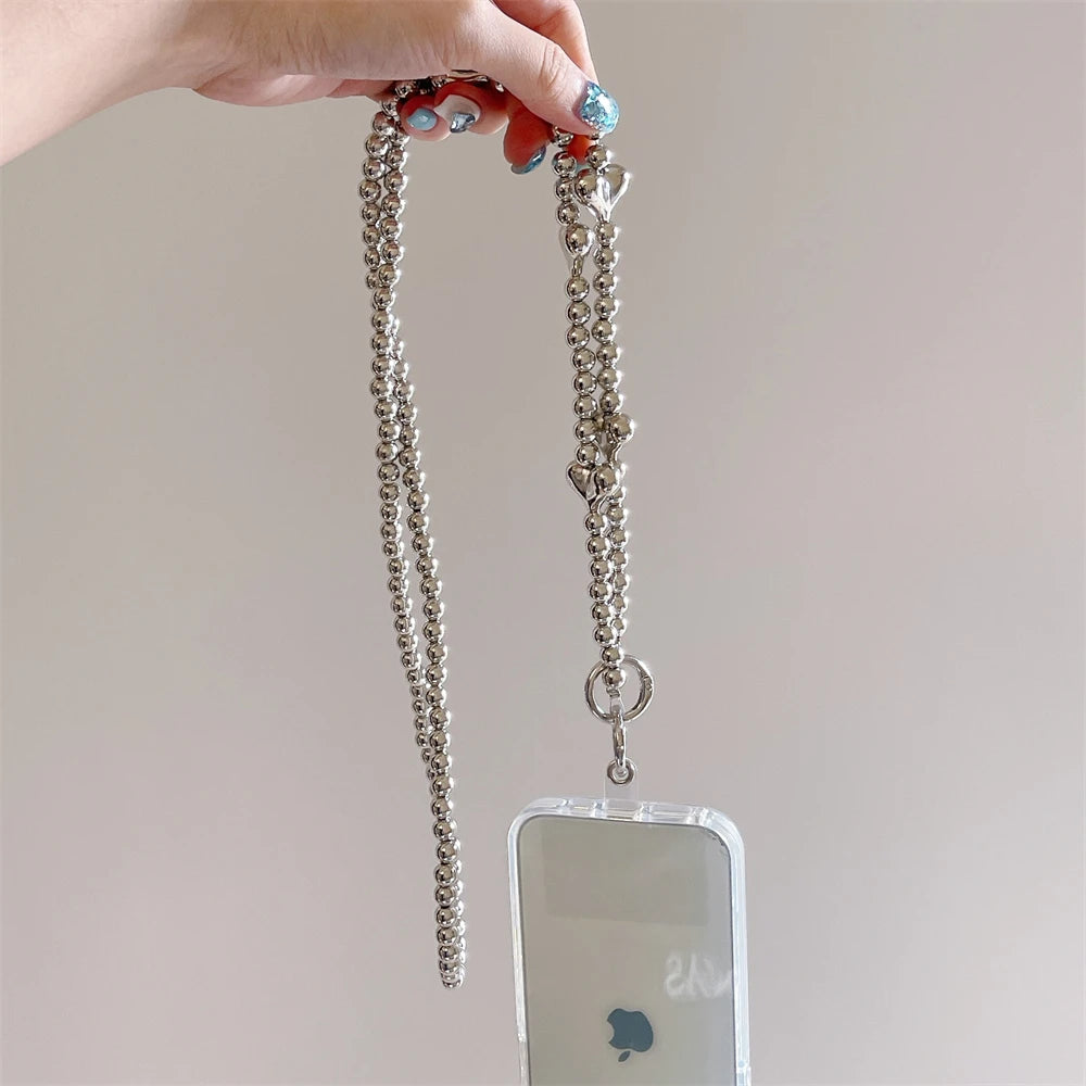 🎀 Pulsera con Lazo Plateado y Perlas – Lanyard de lujo con diseño de cadena y dije, anti pérdida, ideal para celulares