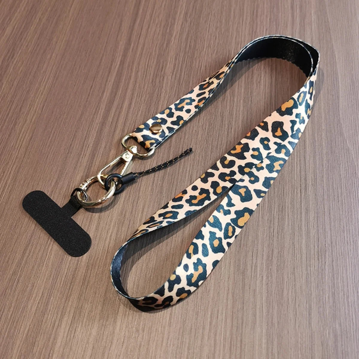 🎀 Lanyard con estampado de leopardo – Correa ajustable para celular, anticaída