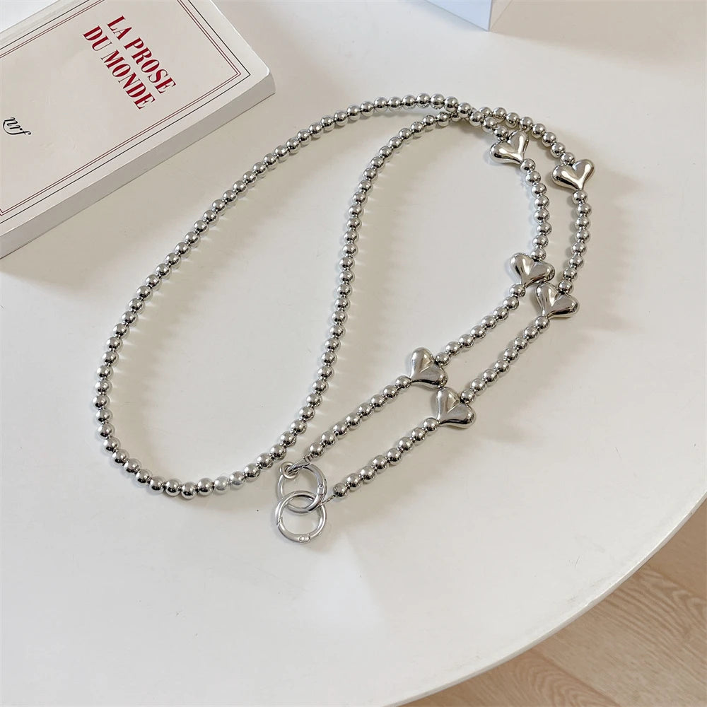 🎀 Pulsera con Lazo Plateado y Perlas – Lanyard de lujo con diseño de cadena y dije, anti pérdida, ideal para celulares