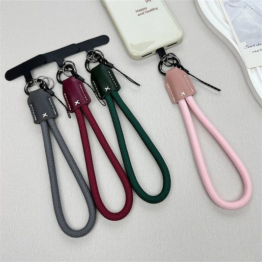 🎀 Lanyard Corto de Nylon y Cuero – Pulsera trenzada anticaídas con clip, cuerda decorativa para funda de celular