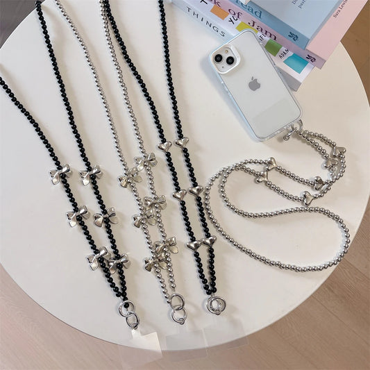🎀 Pulsera con Lazo Plateado y Perlas – Lanyard de lujo con diseño de cadena y dije, anti pérdida, ideal para celulares