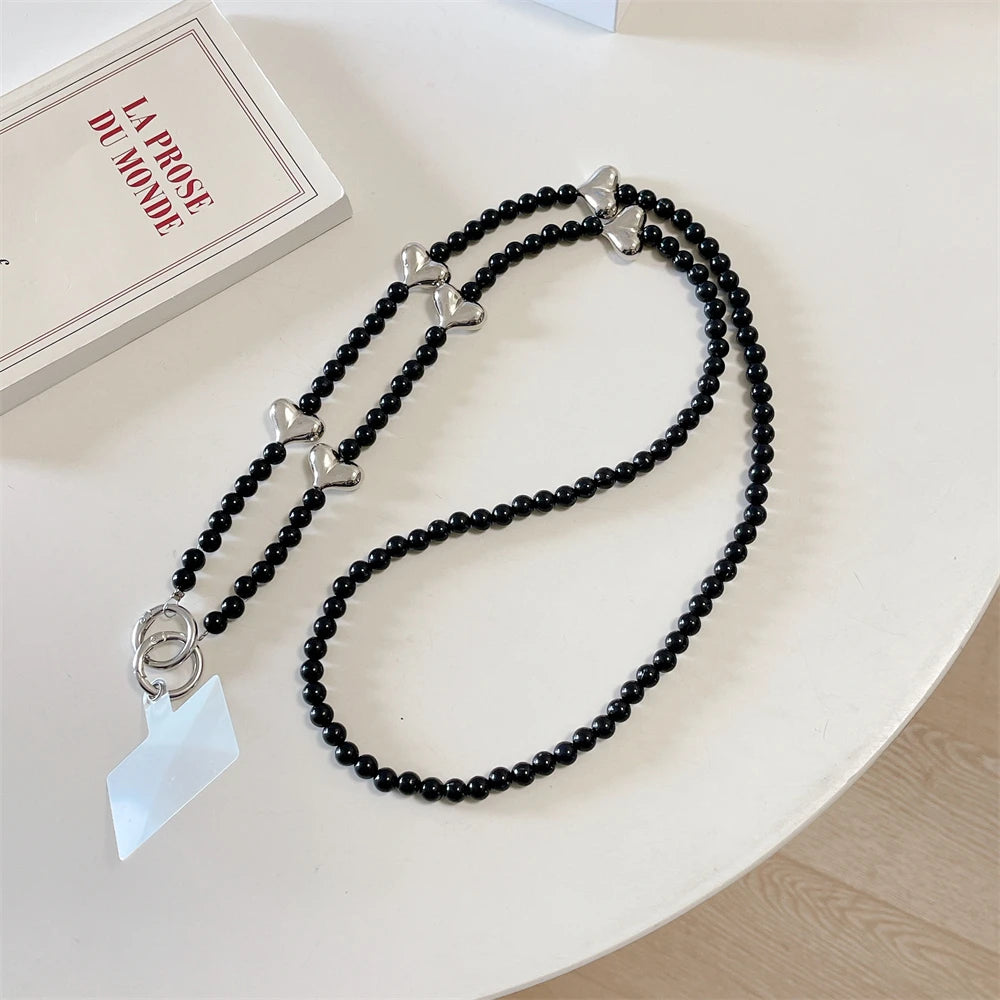 🎀 Pulsera con Lazo Plateado y Perlas – Lanyard de lujo con diseño de cadena y dije, anti pérdida, ideal para celulares